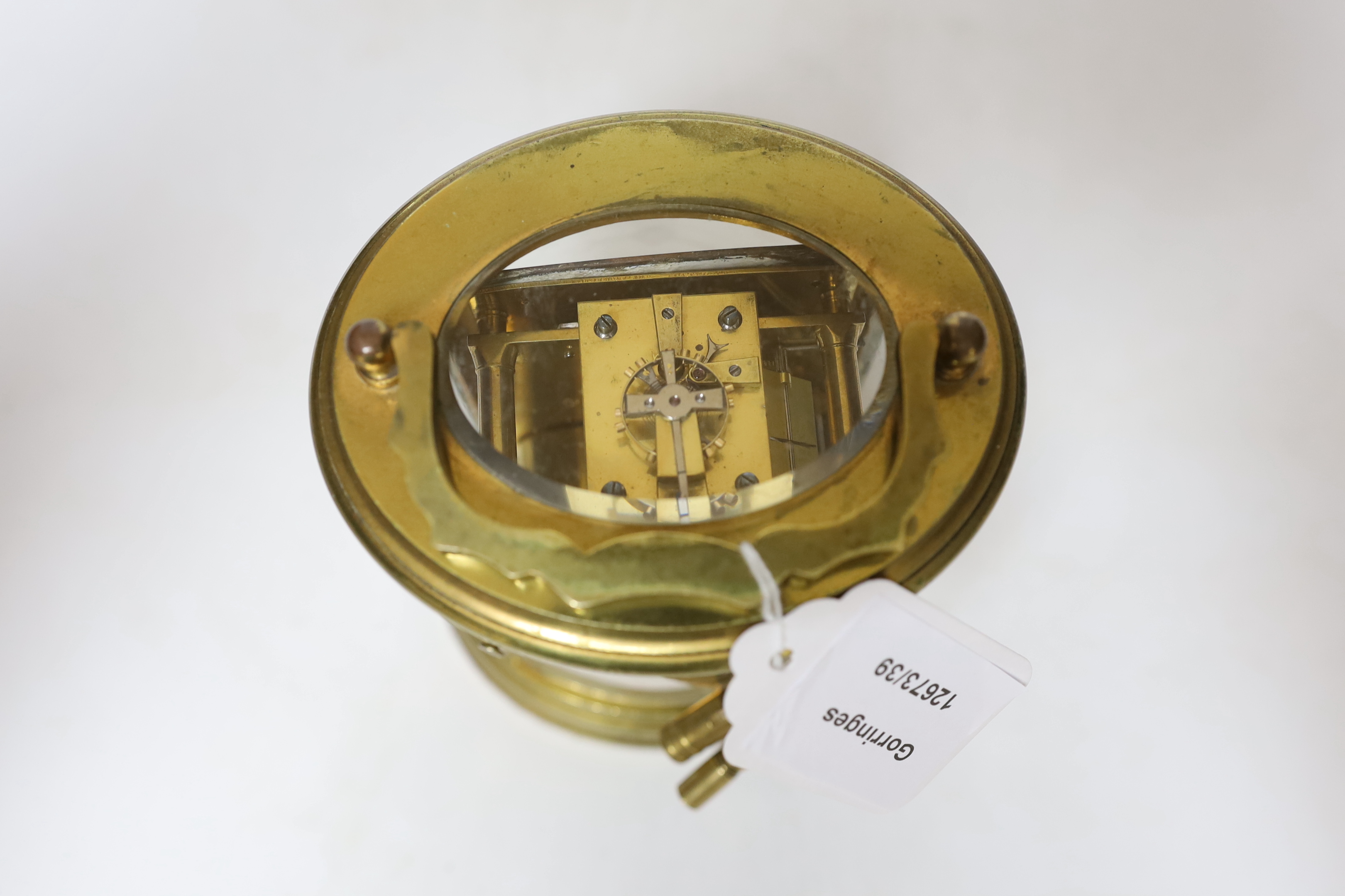 A late 19th century French oval brass cased eight day carriage clock